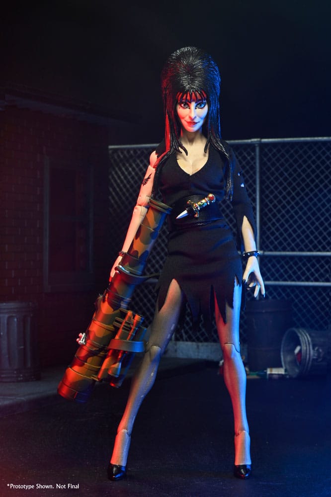Accesorios incluidos en la figura Elvira Clothed Commando: cabeza extra, libro y lanzacohetes