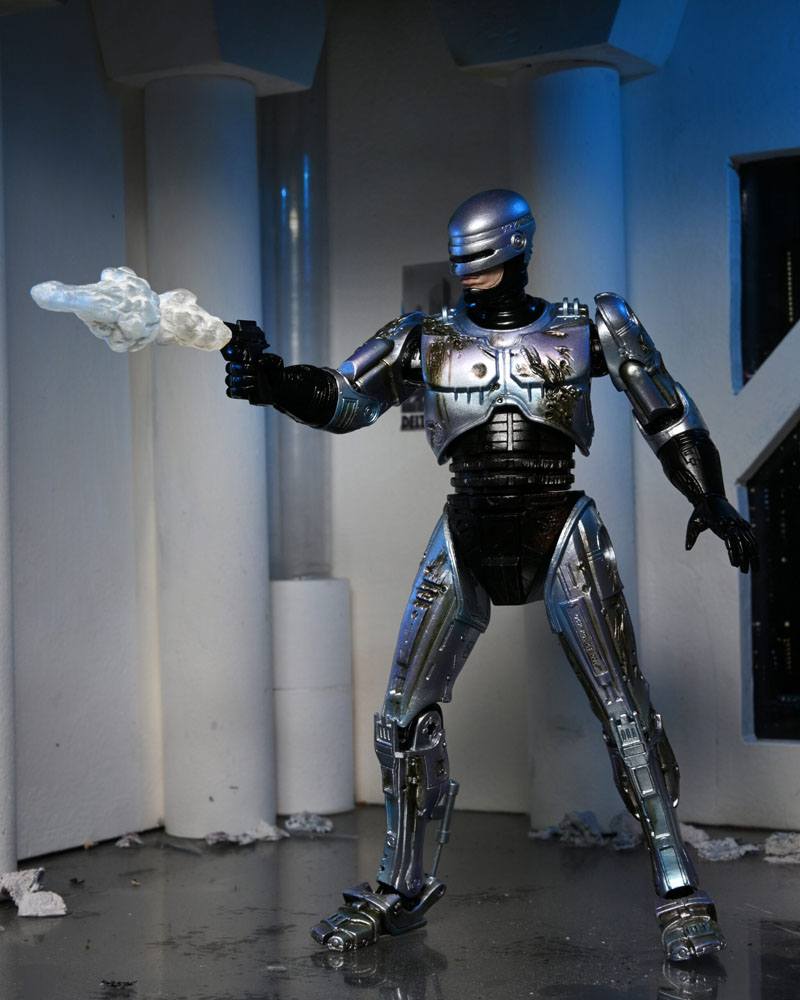 ROBOCOP ULTIMATE BATTLE DAMAGED WITH CHAIR – FIGURA 18 CM (NECA – ROBOCOP)