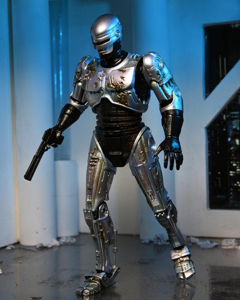 ROBOCOP ULTIMATE BATTLE DAMAGED WITH CHAIR – FIGURA 18 CM (NECA – ROBOCOP)