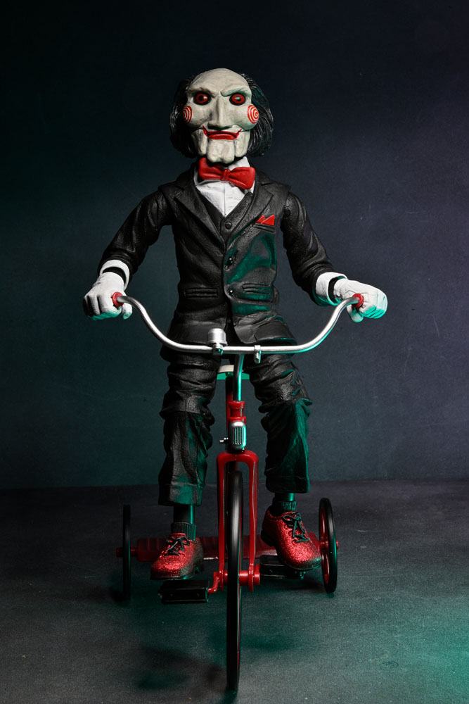 BILLY WITH TRICYCLE – SAW FIGURE WITH SOUND 30 CM (NECA – SAW)