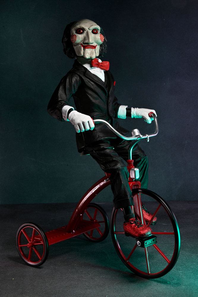 BILLY WITH TRICYCLE – SAW FIGURE WITH SOUND 30 CM (NECA – SAW)