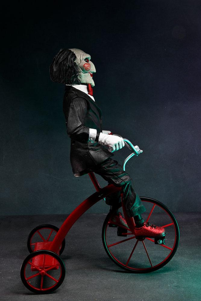 BILLY WITH TRICYCLE – SAW FIGURE WITH SOUND 30 CM (NECA – SAW)