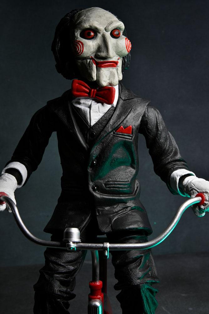 BILLY WITH TRICYCLE – SAW FIGURE WITH SOUND 30 CM (NECA – SAW)
