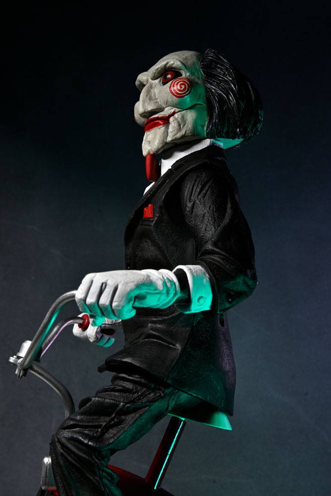 BILLY WITH TRICYCLE – SAW FIGURE WITH SOUND 30 CM (NECA – SAW)