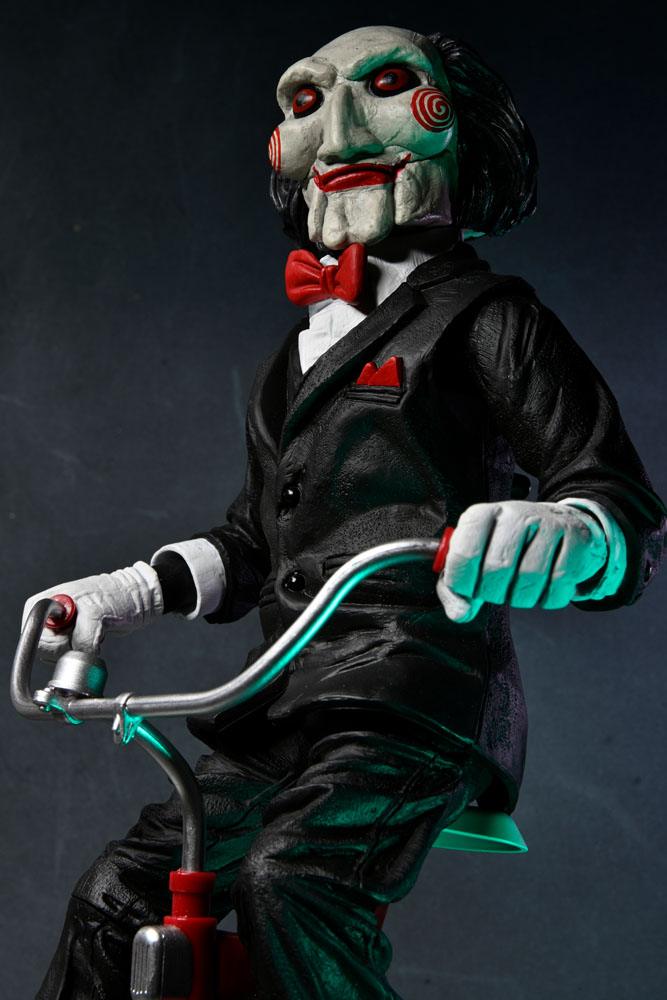 BILLY WITH TRICYCLE – SAW FIGURE WITH SOUND 30 CM (NECA – SAW)