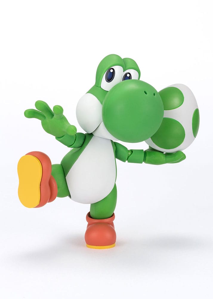 Figura de acción de Yoshi con bloque de pregunta, base verde y pose dinámica.