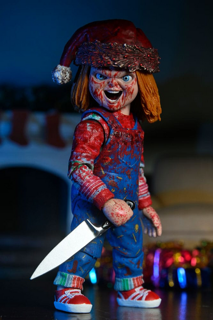 Figura Chucky edición navideña con gorro rojo y cuchillo – NECA Ultimate.