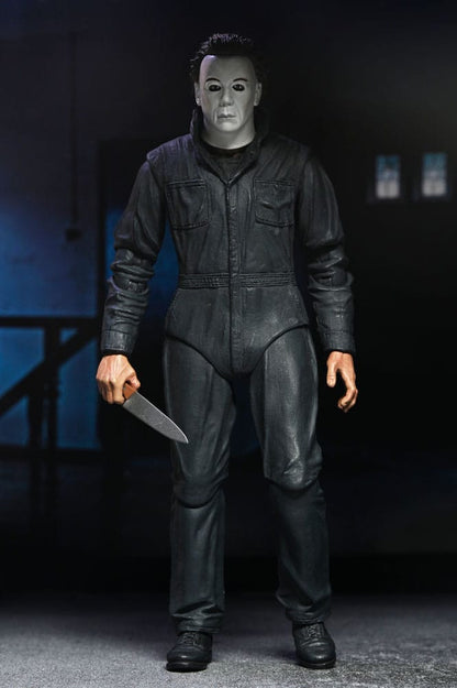 Figura articulada Michael Myers NECA con accesorios, cámara y muñeca de la película Halloween Resurrection.