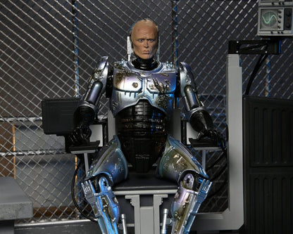 ROBOCOP ULTIMATE BATTLE DAMAGED WITH CHAIR – FIGURA 18 CM (NECA – ROBOCOP)