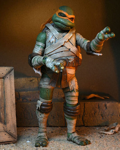 MICHELANGELO AS THE MUMMY – UNIVERSAL MONSTERS x TEENAGE MUTANT NINJA TURTLES ULTIMATE FIGURA 18 CM (NECA – TMNT)