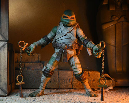 MICHELANGELO AS THE MUMMY – UNIVERSAL MONSTERS x TEENAGE MUTANT NINJA TURTLES ULTIMATE FIGURA 18 CM (NECA – TMNT)