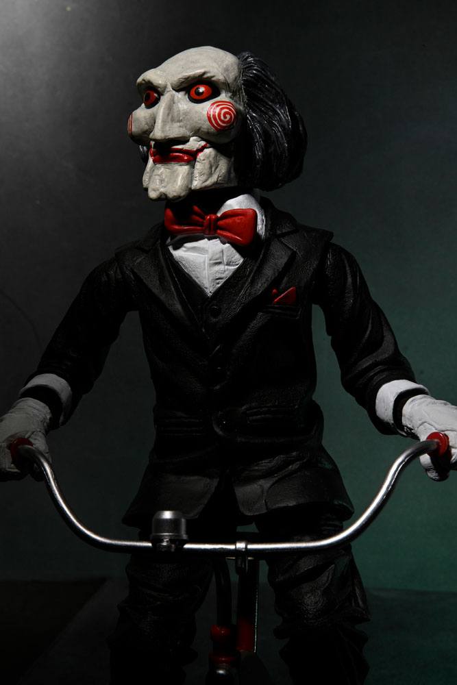 BILLY WITH TRICYCLE – SAW FIGURE WITH SOUND 30 CM (NECA – SAW)